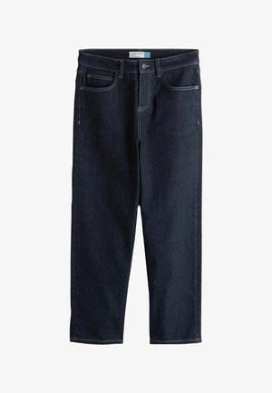 Tumši zili, potītes garuma, taisna griezuma džinsi ar piecām kabatām un redzamām šuvēm uz balta fona.