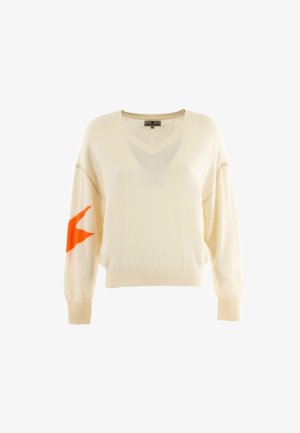 Pull crème avec un col en V, manches longues et un design d'étoile orange sur la manche gauche. Texture douce et tricotée.