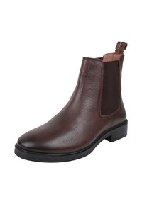 Brązowy skórzany kowbojek Chelsea z elastycznymi panelami bocznymi, pętlą z tyłu, czarną podeszwą i niskim obcasem.