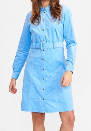 Light blue shirt dress with a button-down front, long sleeves, belted waist, and gold-tone buttons. Made from soft fabric with a smooth texture.