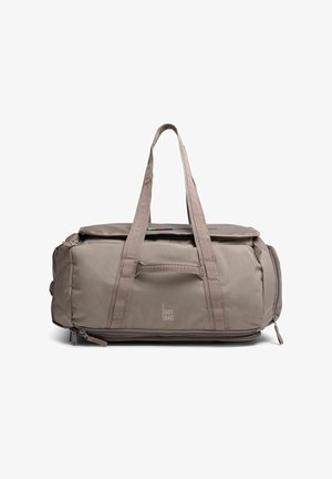 Borsa a sacco beige con doppie maniglie, tasca frontale con cerniera, scomparti laterali e logo "GOT BAG" al centro davanti.