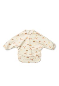 Cream-colored long-sleeve smock with a kangaroo pocket, featuring a playful pattern of leaping dogs, clouds, and rainbows in soft colors.