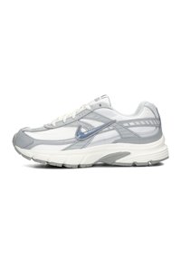 Nike running shoe featuring a mix of grey and white mesh material, with a textured sole, and reflective accents on the sides.