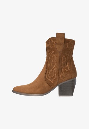 Brown suede ankle boot with stacked block heel and decorative stitched patterns on the shaft and pull tab.