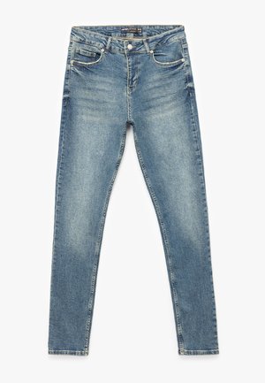 Slankjeans i lys blå denim med et klassisk fem-lomme design, lynlås, knaplukning og diskret falmning over det hele.