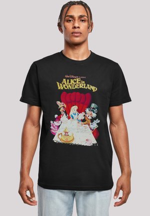 Black cotton t-shirt featuring a colorful "Alice in Wonderland" graphic, depicting characters at a tea party with whimsical details and bold lettering.