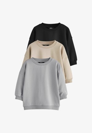 Tre langærmede crewneck-sweatshirts i sort, beige og lysegrå stablet lodret på en hvid baggrund.