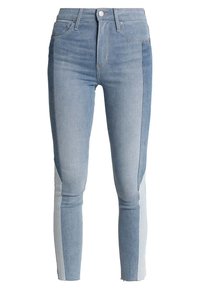 Slim-fit blue jeans with contrasting light and dark denim panels along the legs, front button, and zipper closure.