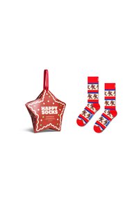 Red star-shaped packaging features white text and colorful polka dots. Socks are red with gingerbread man patterns and blue stripes.