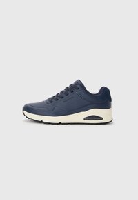 Navy blue athletic shoes with a smooth texture, featuring perforated accents, lace-up design, and a white midsole with a visible air pocket.