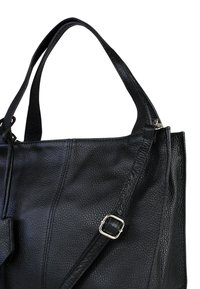 Black leather handbag with a textured surface, featuring dual carrying straps, an adjustable shoulder strap, and silver hardware accents.