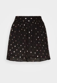 Jupe noire avec une taille froncée, ornée de pois métalliques dorés rose brillant, légère, superposée d'un tissu transparent au niveau de l'ourlet.