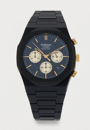 Must D1 Milano kronograafiga käekell kuldsete aktsentidega, kolme alamnäidiku ja metallist lülistatud rihmaga, näidates aega 1:11:52.