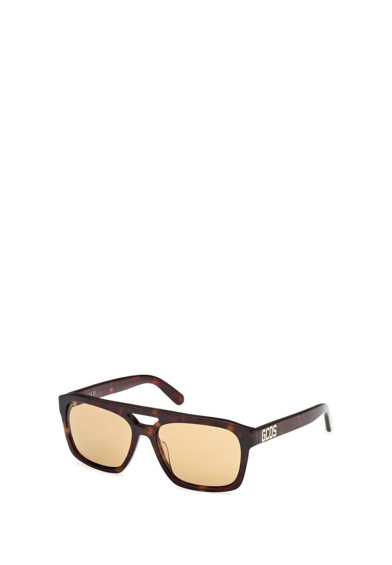 Gafas de sol rectangulares de carey marrón con lentes de color marrón claro y logo "GCDS" en las patillas.