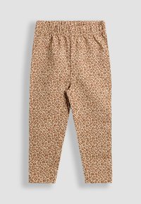 Bézs leggings barna leopárdmintával és elasztikus derékkal, világosszürke háttéren, laposan elhelyezve.
