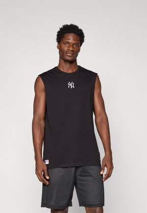 Black sleeveless shirt with white New York Yankees logo at center, paired with black mesh shorts featuring geometric patterns.