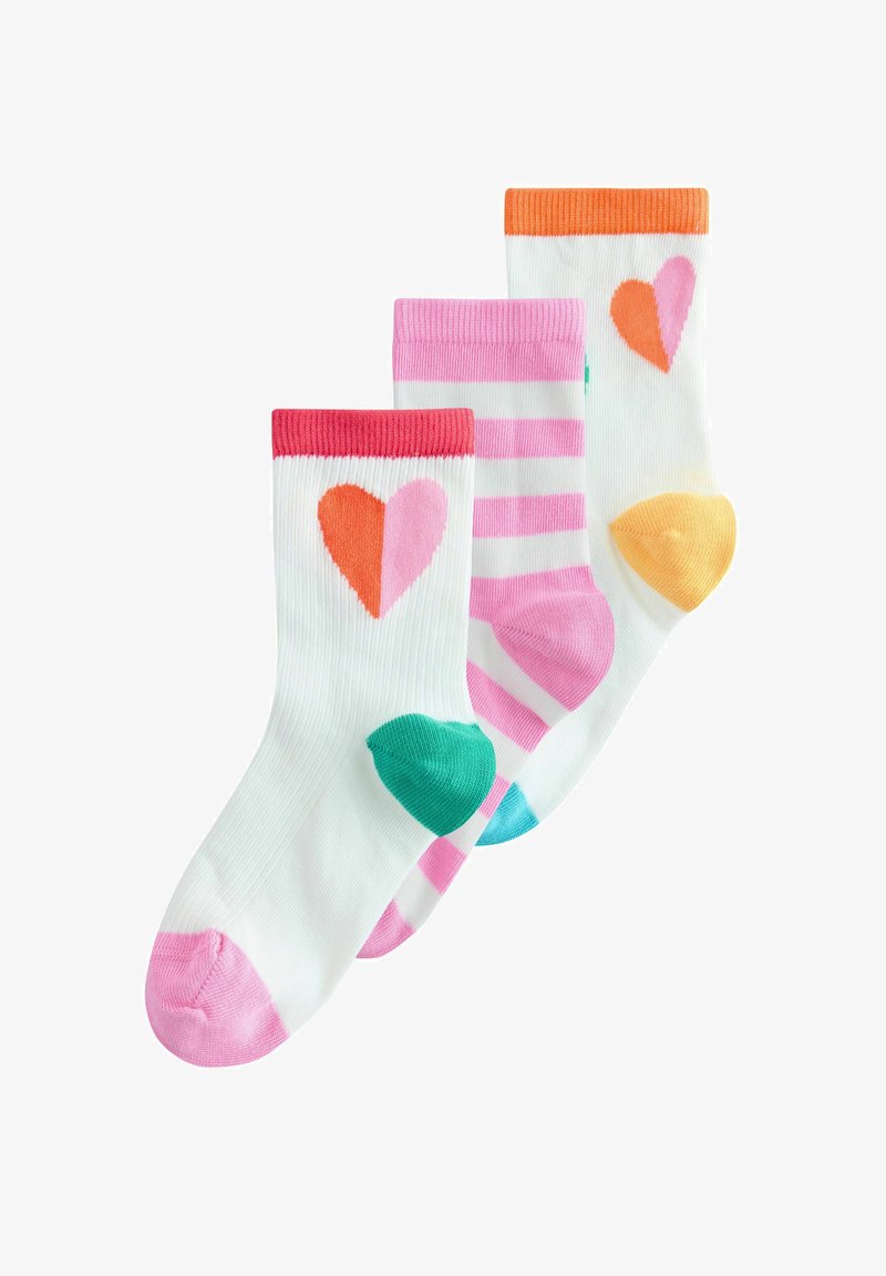 Three pairs of white socks featuring colorful heart designs: one with a red and orange heart, another striped pink, and a third with orange accents.
