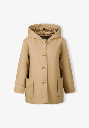 Beige krāsa ap metieniem ar gludu tekstūru, ar četriem pogām, divām priekšējām kabatām un odēto iekšpusi. Vienkārša dizaina ar tīrām līnijām.