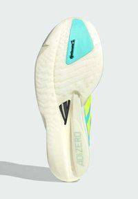 Potplat cipela s teksturiranim dizajnom. Sadrži zelene i žute akcentne boje uz plavi Continental logo i istaknutu ADIZERO oznaku.