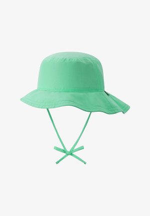 Jasnozielony kapelusz typu bucket z szerokim rondem i regulowanymi paskami pod brodę związanymi w kokardę, pokazany na białym tle.