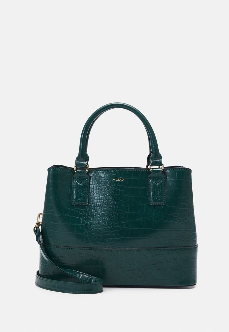 Sac à main vert foncé en cuir synthétique effet crocodile avec doubles poignées, bandoulière amovible et logo doré "ALDO" sur le devant.
