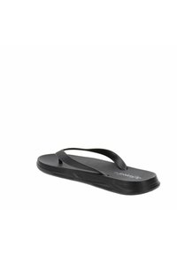 Chancla negra con plantilla texturizada, correas de goma y suela ligeramente contorneada. Diseño ligero adecuado para uso casual.