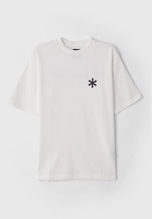 White cotton t-shirt with short sleeves, featuring a small black asterisk logo on the left chest area. Smooth texture, classic crew neckline.
