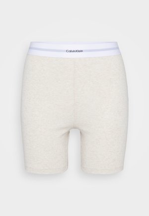 Beige Baumwollmischungshorts mit einem weißen elastischen Bund, der eine dezente Textur und Calvin Klein Branding aufweist.