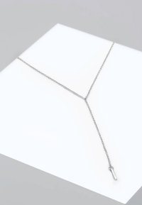 Silver Y-shaped necklace with a fine chain and a vertical pendant, featuring a smooth surface and a minimalist design.