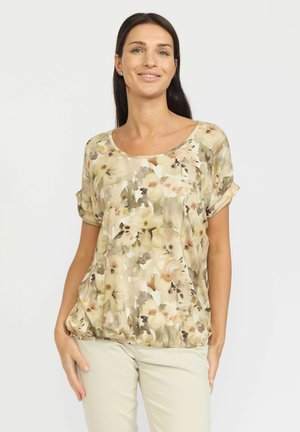 Blomsterpryntet, kortermet topp i beige, med rundet utringning og samlet hem for en avslappet passform.