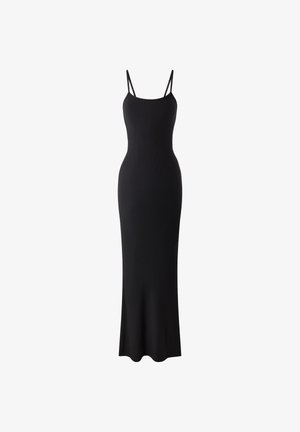 Black ribbed maxi dress with thin adjustable straps, fitted silhouette, and a gently flared hem. Made from a stretchy fabric for comfort.