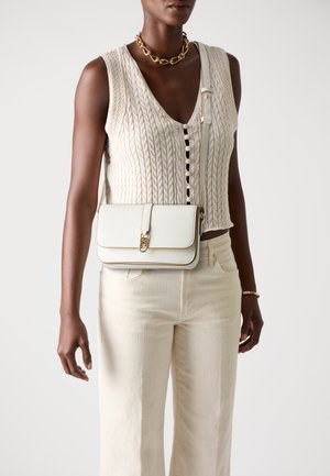 Tommy Hilfiger LIBRE FLAP CROSSOVER - Cross body bag - ivory silk
