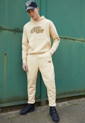 PANT - Träningsbyxor - sesame/black
