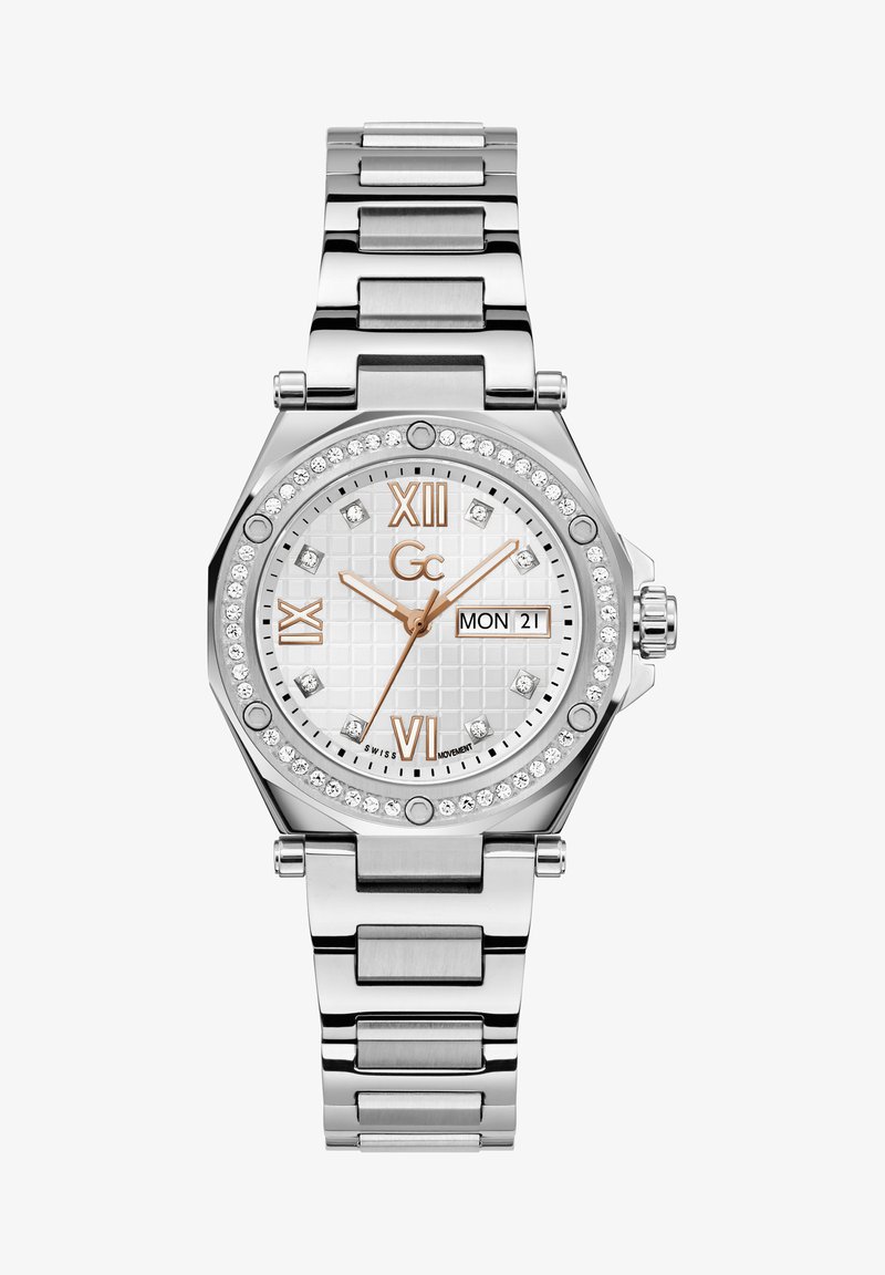 Orologio in acciaio inossidabile argento con cassa ottagonale, quadrante bianco strutturato, dettagli in oro rosa, display della data e decorazioni in cristallo.