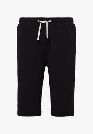 Pantaloni corti in cotone neri con cintura elastica, dotati di un laccetto bianco e una singola tasca frontale. Texture liscia con orlo dritto.