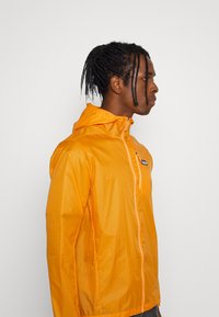 Patagonia HOUDINI - Corta-vento - cloudberry orange
