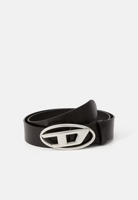 Black leather belt featuring a prominent silver oval buckle with a stylized letter D. The belt is smooth with a matte finish.
