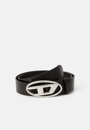 Black leather belt featuring a prominent silver oval buckle with a stylized letter D. The belt is smooth with a matte finish.