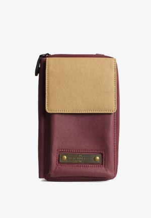 Maroon wallet with a beige flap, made of textured fabric. Features a metal nameplate with brass accents and zip closure.