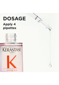 Bouteille en verre transparent contenant un liquide rose, étiquetée "Kérastase Paris K GENESIS." Pipette distribuant une goutte, avec le texte "DOSAGE : Appliquer 4 pipettes."
