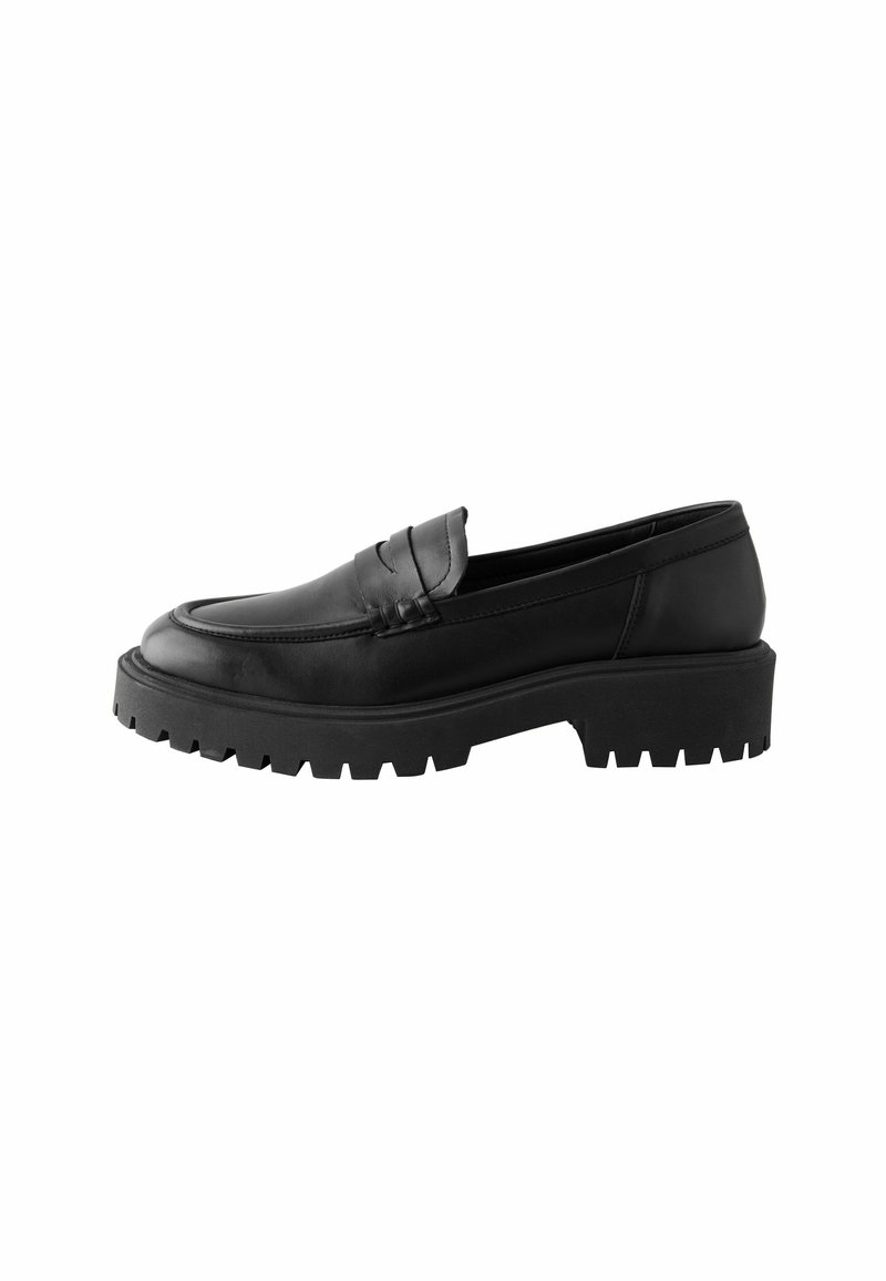 Black leather loafer with a rounded toe, raised seam detail, and chunky rubber sole featuring deep treads for traction.
