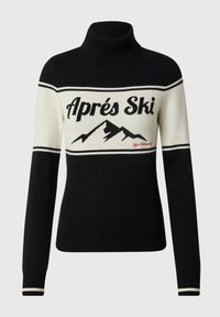 Suéter de cuello alto en blanco y negro con el texto "Après Ski" y un diseño de montaña. Presenta rayas en contraste y puños acanalados. Material de tejido suave.
