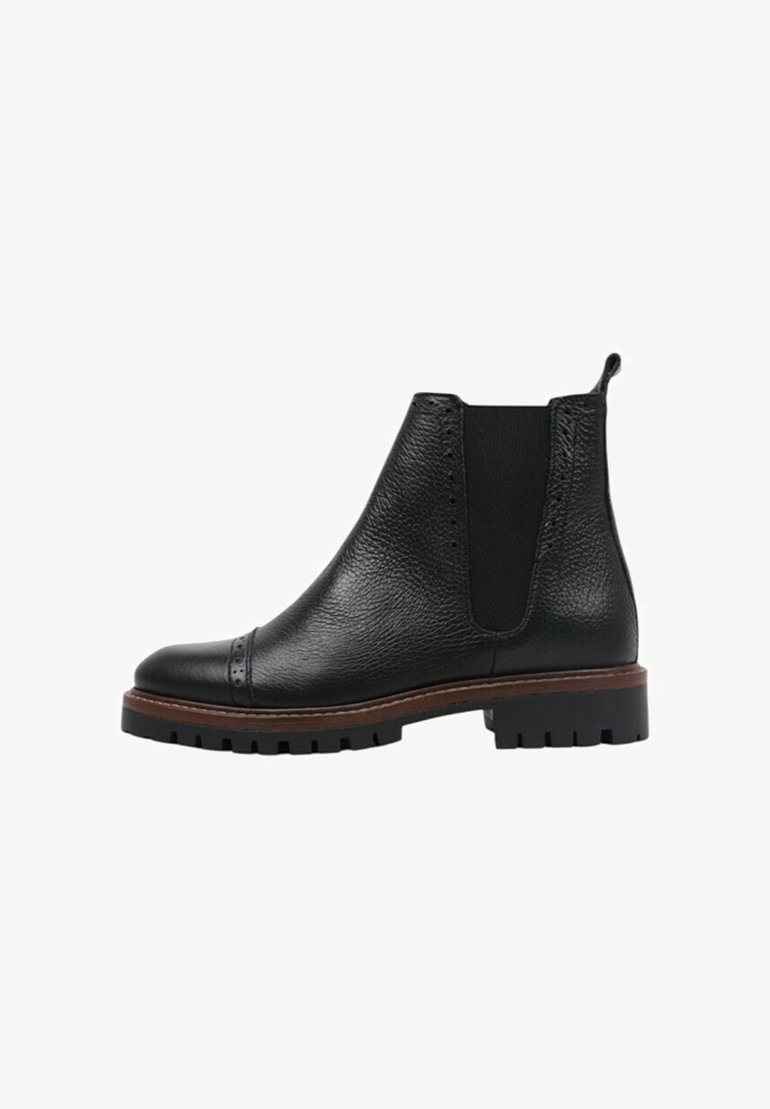 Black leather ankle boot featuring a textured finish, elastic side panels, brogue detailing, and a rugged rubber sole with a stacked heel.