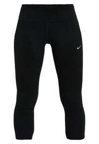 Czarne legginsy sportowe o dopasowanym kroju, wykonane z elastycznego materiału. Na dolnej części nogawki znajduje się małe białe logo Nike.
