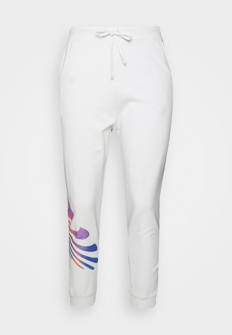 White jogger pants with a drawstring waist. Features a colorful abstract pattern in purple, red, and blue on one side. Soft fabric.