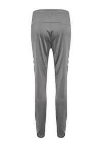 Pantalons de sport gris avec une texture lisse, dotés d'un design ajusté et d'un logo blanc contrastant sur les côtés. Ceinture élastique.