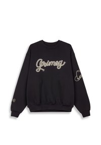 Sudadera negra de mezcla de algodón con la palabra "Grimey" en un script crema, puños acanalados y cinturilla elástica, con un logo en la manga.