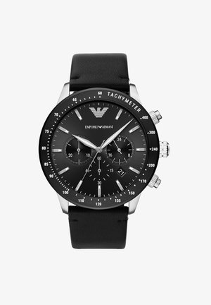 Montre chronographe avec un bracelet en cuir noir et un boîtier en acier inoxydable. Caractéristiques : cadran noir, accents argentés et fonction tachymétrique.