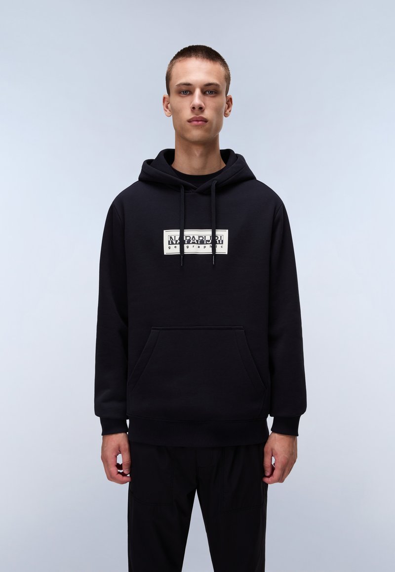 Black pullover hoodie in soft fabric features a front pocket and drawstring hood. White logo prominently displayed on the chest area.
