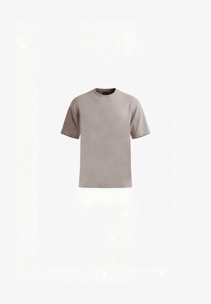 T-shirt basique à manches courtes et col rond, de couleur taupe clair unie, présenté à plat sur un fond blanc.